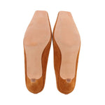 Camel suede mules showing soles and footbed lining
