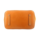 Back view of taupe Carissa satchel with tan leather trim and two hanging grommet tabs.
