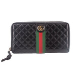 Black quilted leather wallet with green and red Web stripe and GG logo, zip front.
