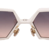 CHRISTIAN DIOR sunglasses close-up, white frame with CD logo and gold hardware