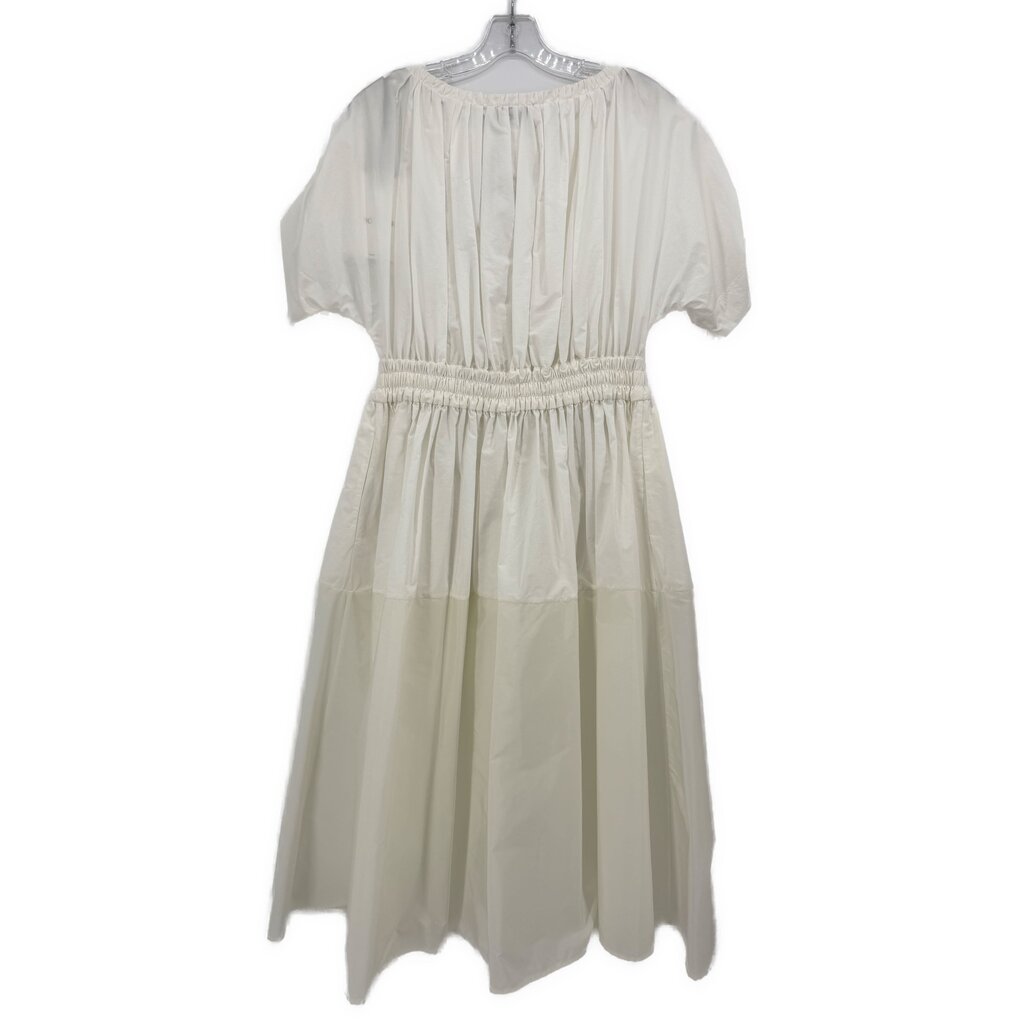 White short-sleeve dress with gathered bodice, elastic waist, and puff sleeves