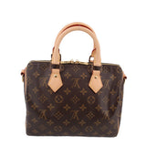 Louis Vuitton monogram crossbody bag, front view with tan leather tabs and handles