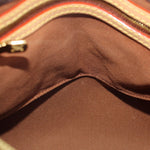 Louis Vuitton monogram bag interior, brown lining with curved seam and gold trim