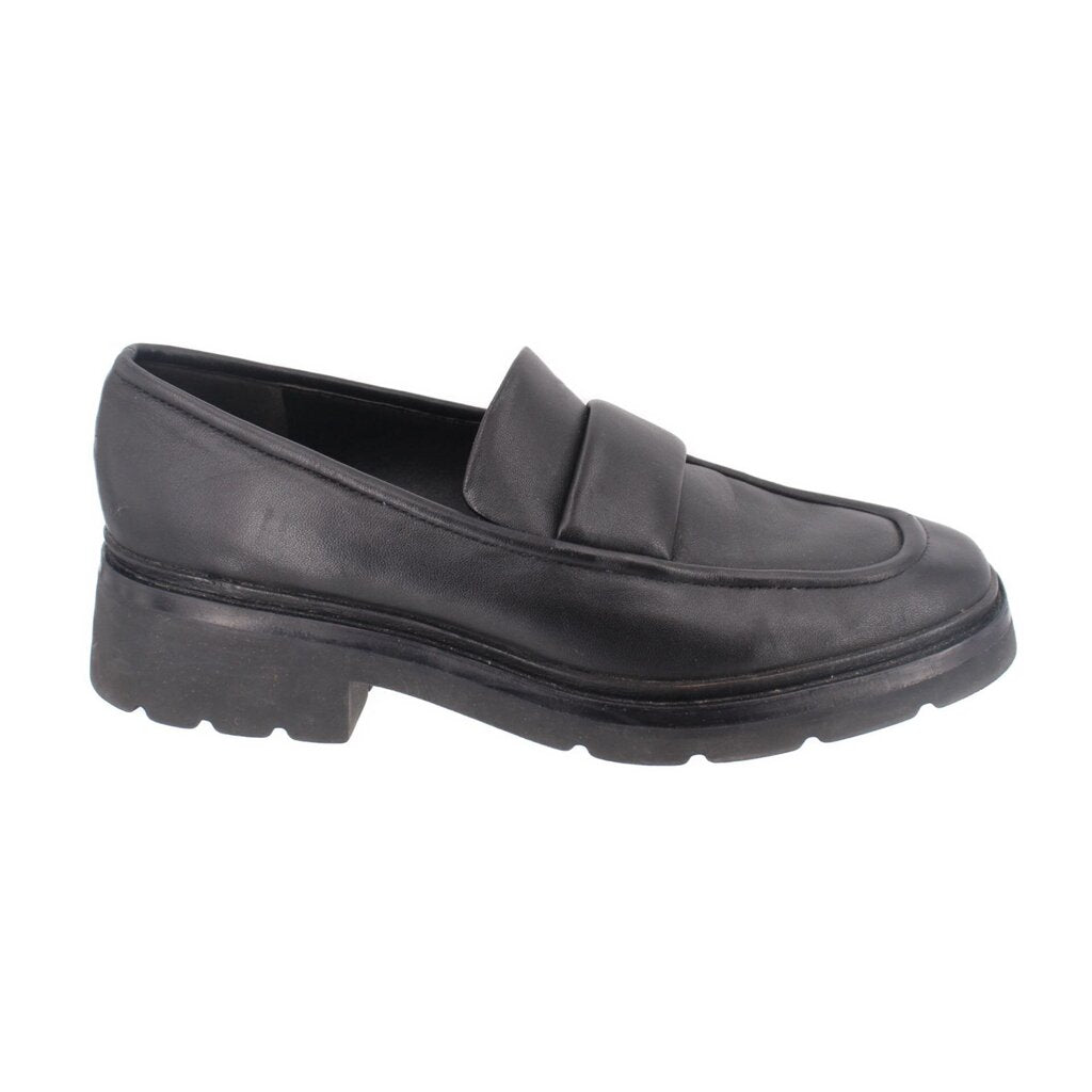 Black leather loafer from side angle with slip-on strap and thick tread sole