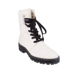 White lace-up ankle boots with fur-trim collar and black rubber sole
