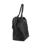 Black drawstring tote bag with long handles and side seam detailing, angled view.