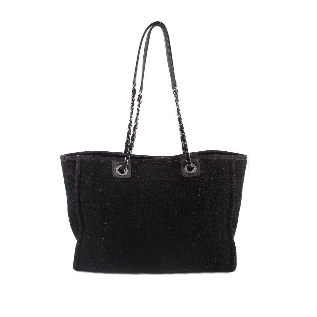 Black CHANEL tote bag with chain handles and minimal front design
