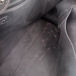 Black CHANEL tote bag interior lining with light speckled marks