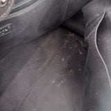 Black CHANEL tote bag interior lining with light speckled marks