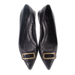 Pair of black snake-print flats with gold-trimmed buckles and pointed toe