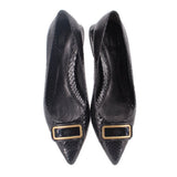 Pair of black snake-print flats with gold-trimmed buckles and pointed toe