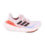 White mesh lace-up running sneakers with Ultraboost text, black-and-blue stripes, orange heel