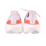 White mesh sneakers with orange heel tabs and rear cushioning, lace-up design