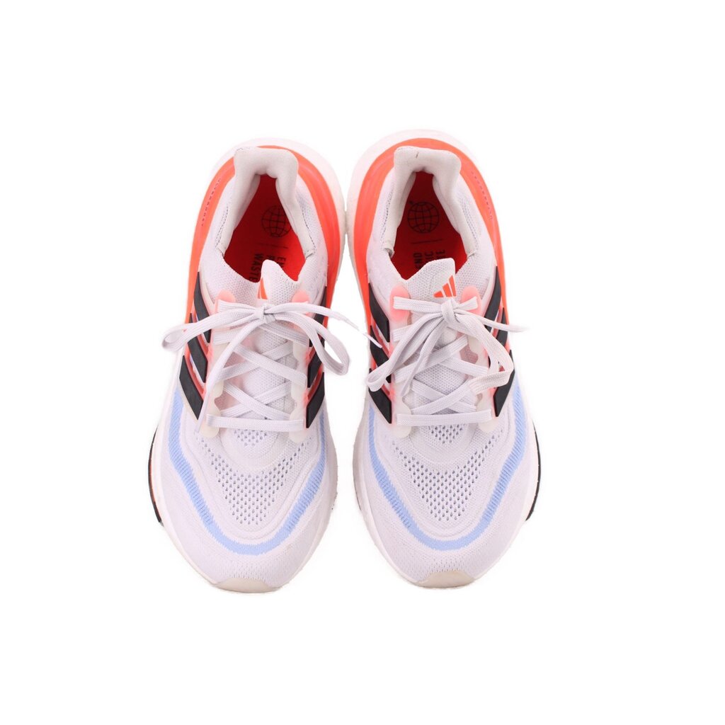 White mesh lace-up sneakers, front view with breathable pattern and orange-lined collar