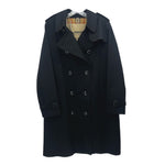 Black Burberry double-breasted trench coat with notched lapels and waist belt