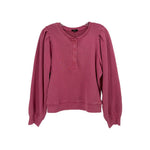 Pink long-sleeve crewneck top with button placket and puff sleeves