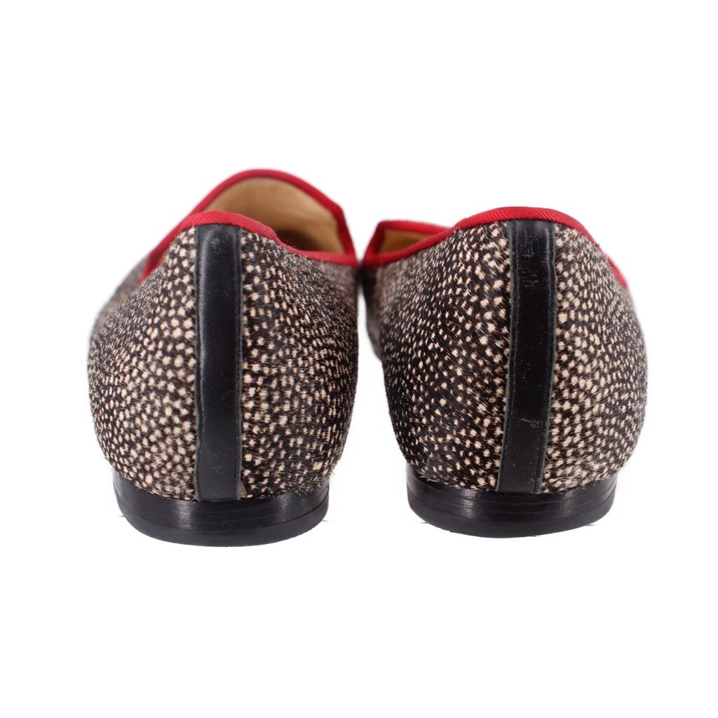 Back view of calf hair loafers with red lining and heel detailing; dark speckled uppers