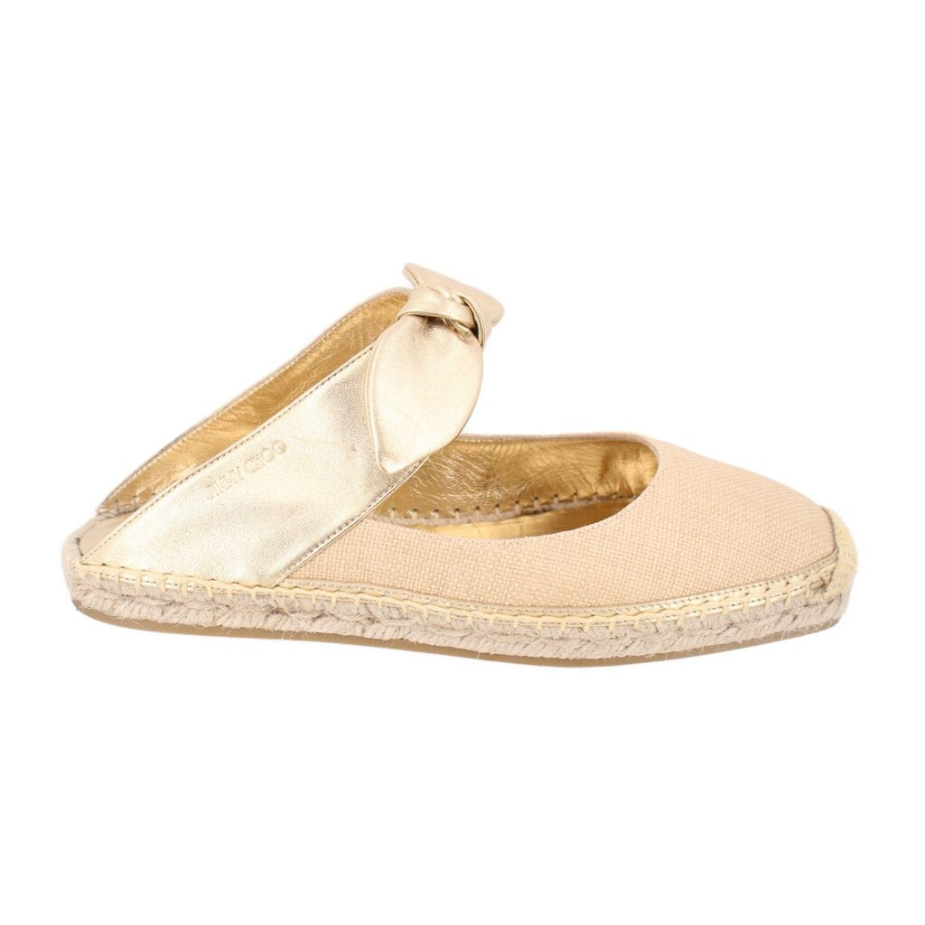 Beige espadrille flat shoes with gold bow and jute-trimmed sole