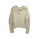 Cream knit sweater with cable diamond pattern, crew neck, ribbed collar and cuffs
