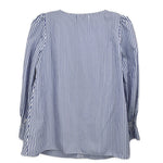 Back view of blue striped blouse top with gathered sleeve cuffs
