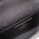Black crossbody bag interior label reading VALENTINO GARAVANI, Made in Italy