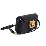 Black crossbody bag with curved flap, gold-tone V logo, and adjustable shoulder strap