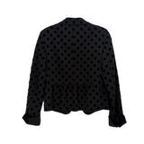 Black polka-dot blazer back view with central seam and long sleeves