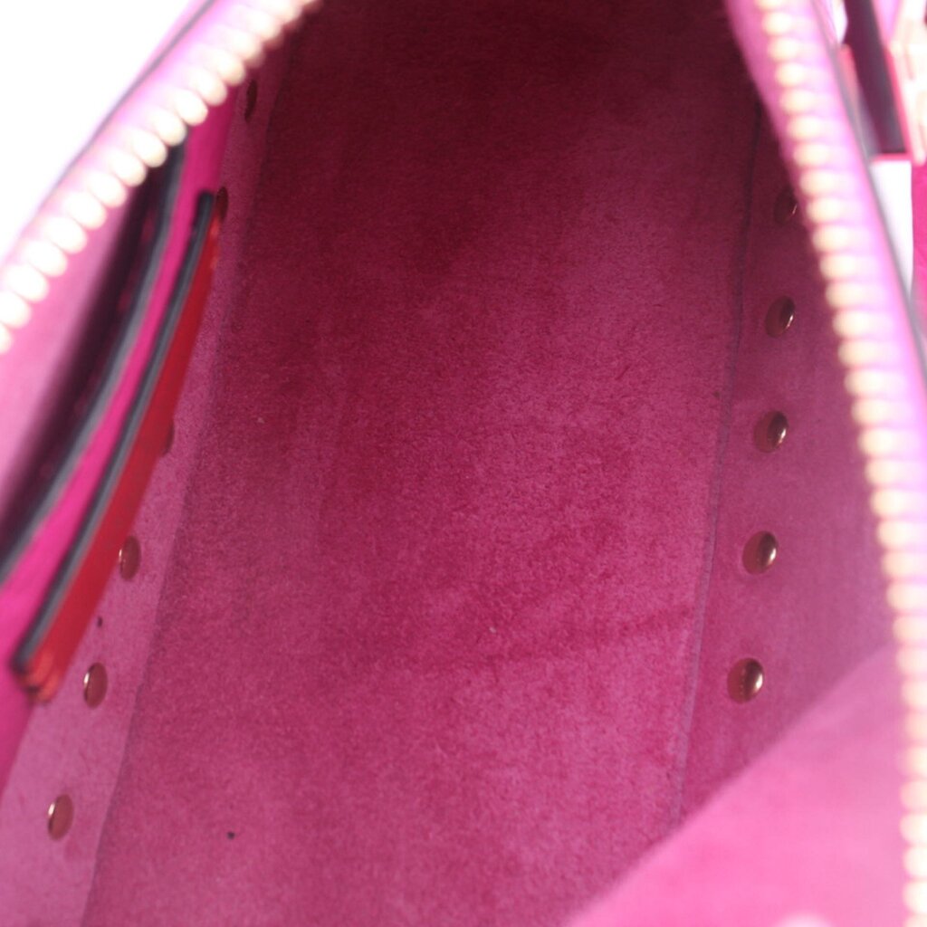 Inside view of pink crossbody bag with stitched edges and fabric lining