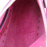 Inside view of pink crossbody bag with stitched edges and fabric lining