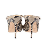 Snake-print stiletto heels with rhinestone trim around open back, rear view