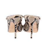 Snake-print stiletto heels with rhinestone trim around open back, rear view