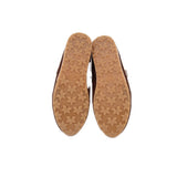 Suede flat outsole with star-pattern tread and textured rubber bottom