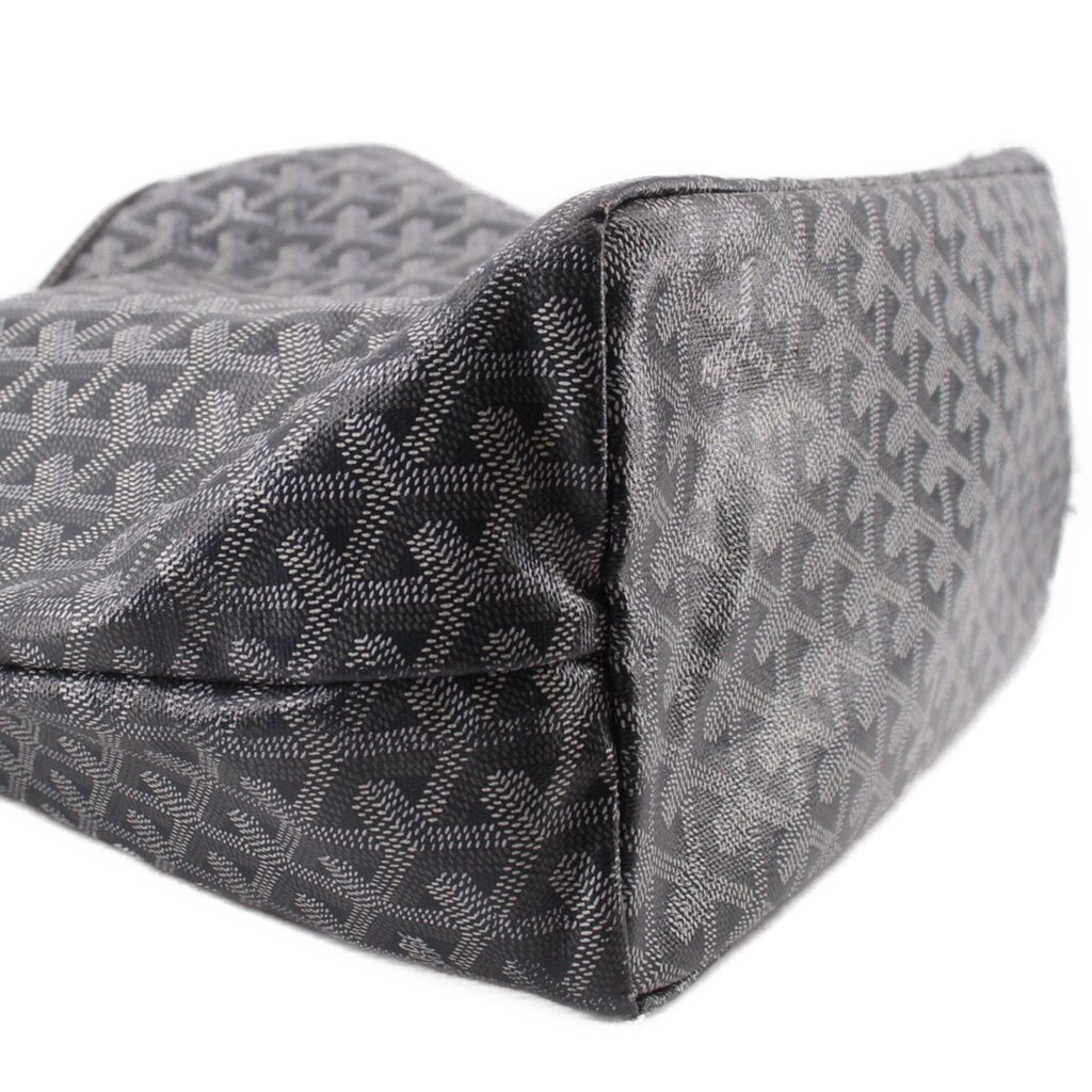 Gray patterned pouch corner with textured trim and stitched seam