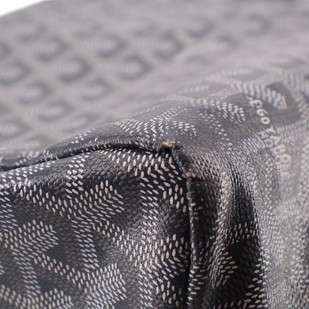 Gray patterned pouch fabric edge with stitching and zipper hardware