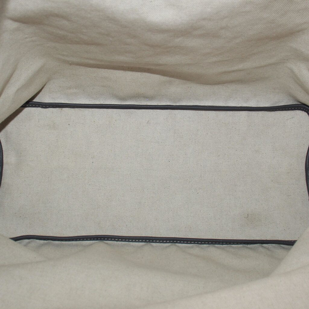 Pouch interior lining with dark trim along the top opening