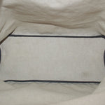 Pouch interior lining with dark trim along the top opening