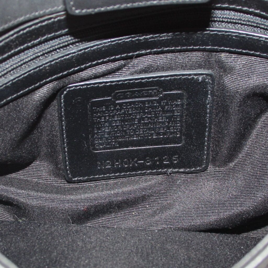 COACH bag interior leather label with embossed text and serial number