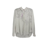White long sleeve button-front top with embroidered leaf pattern and camp collar