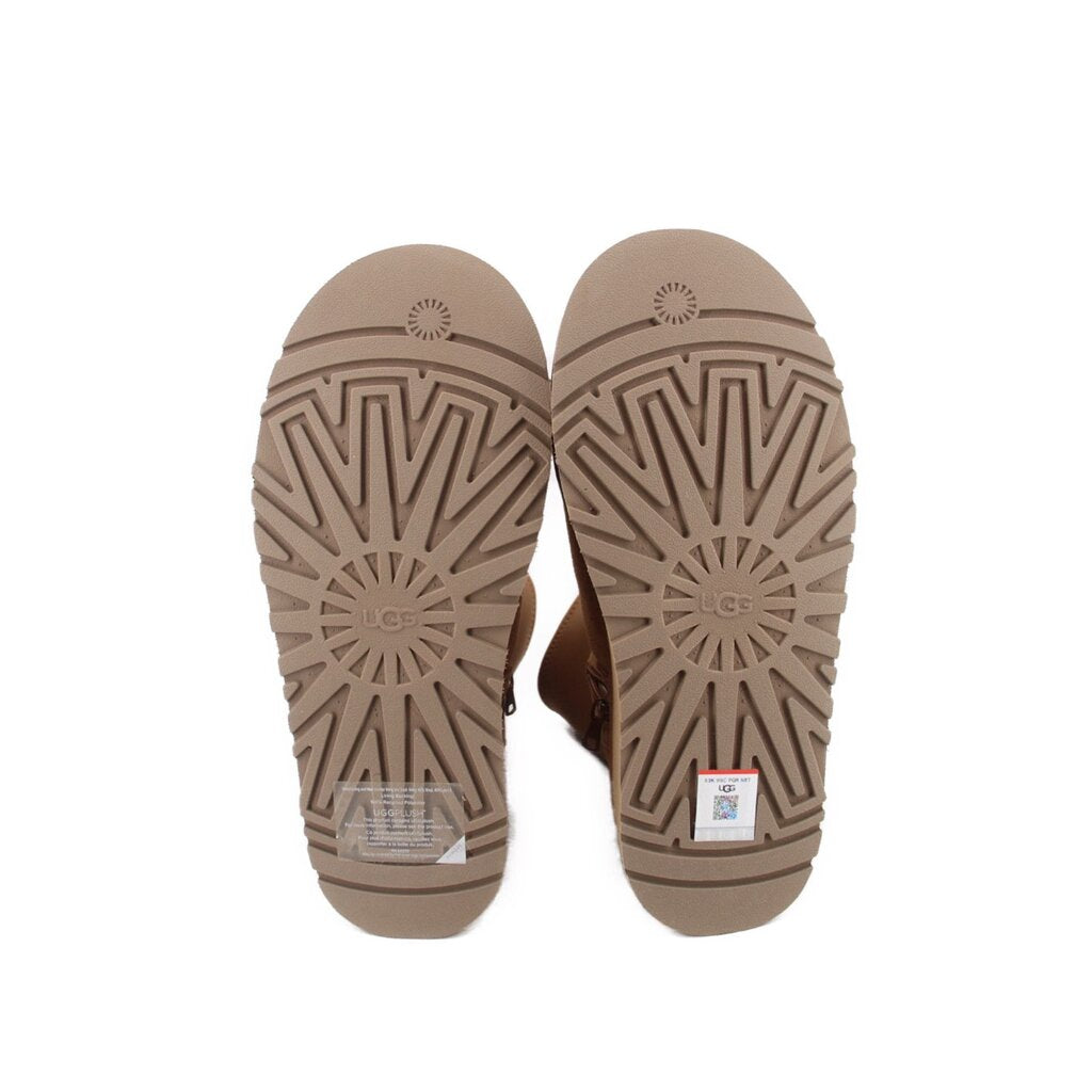 Tan rubber boot outsoles with zigzag tread and starburst wheel-like patterns