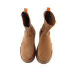 Tan suede chelsea-style boots with orange pull tabs and cushioned interior
