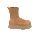 Tan suede ankle boots with orange pull tab, stitched panel, and chunky lug sole