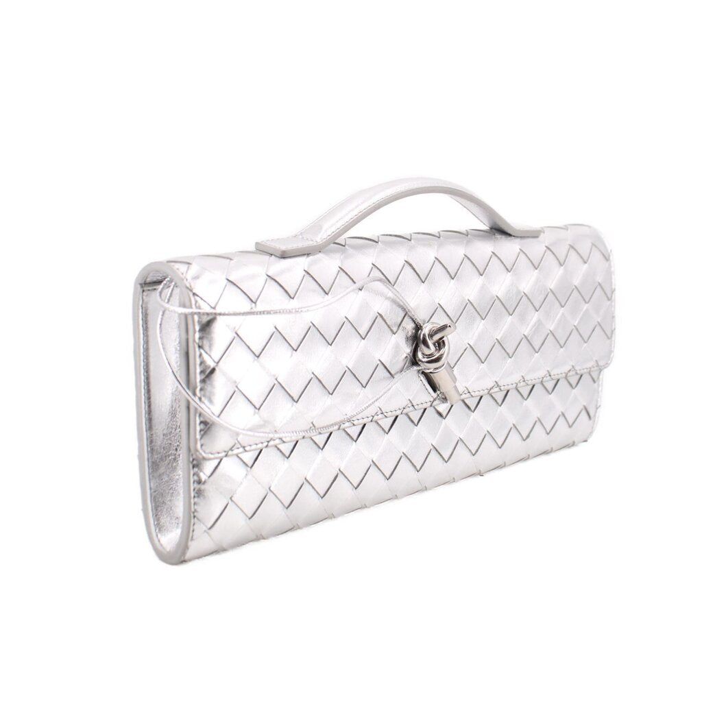 Silver metallic woven clutch with top handle and front clasp, angled view