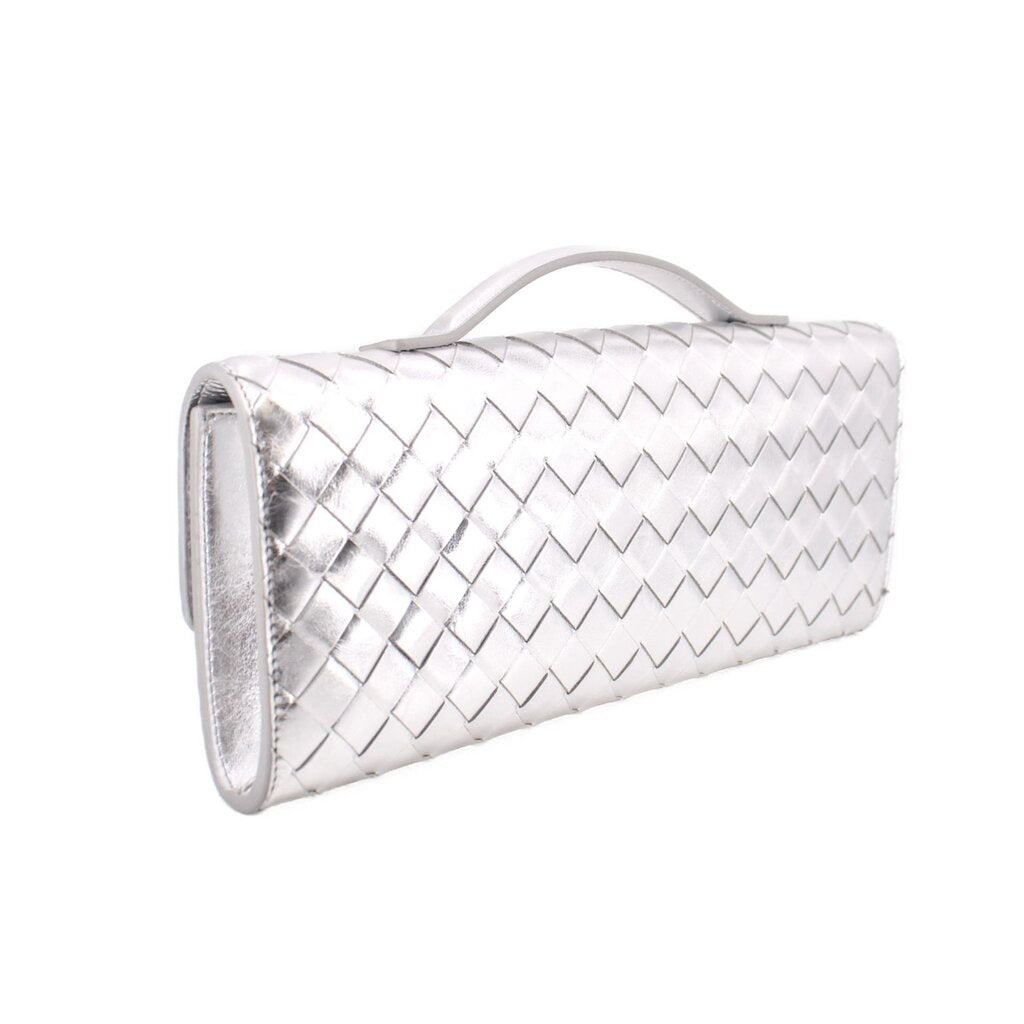 Silver metallic woven clutch with top handle and clasp, side profile