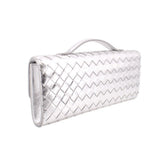 Silver metallic woven clutch with top handle and clasp, side profile