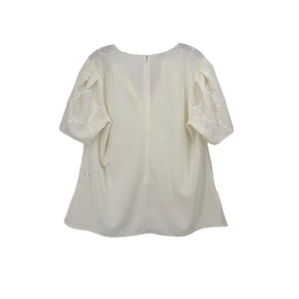 White embroidered blouse top with short sleeves, rounded neckline, relaxed fit