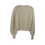 Cream cable-knit crewneck sweater, cropped back view, long balloon sleeves