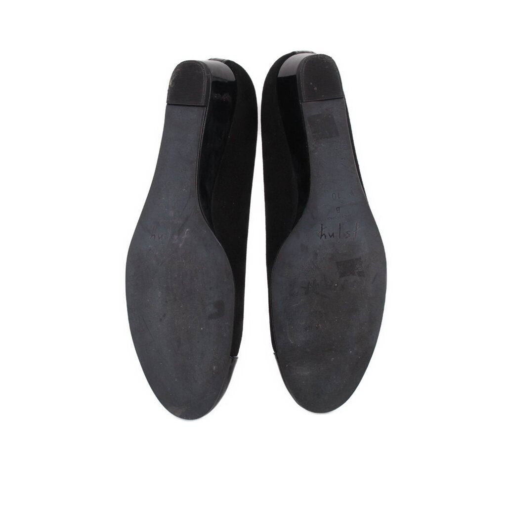 Black wedge flats bottom view with smooth outsole and heel