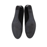 Black wedge flats bottom view with smooth outsole and heel