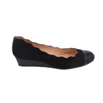 Black wedge flats side view with low wedge heel and glossy toe