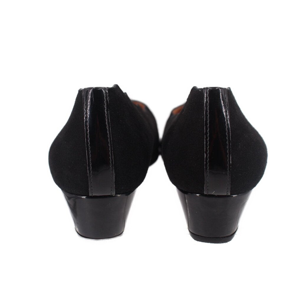 Black wedge flats heel view with low wedge heel and fabric back seam